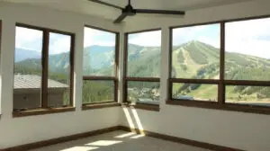 Pella fiberglass windows in Evergreen mountain home with snow-capped peaks
