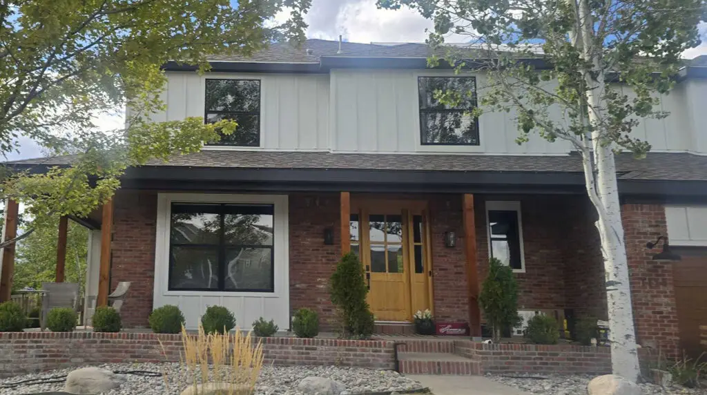 James Hardie board and batten siding in Arctic White with Midnight Black trim on a Highlands Ranch, Colorado home
