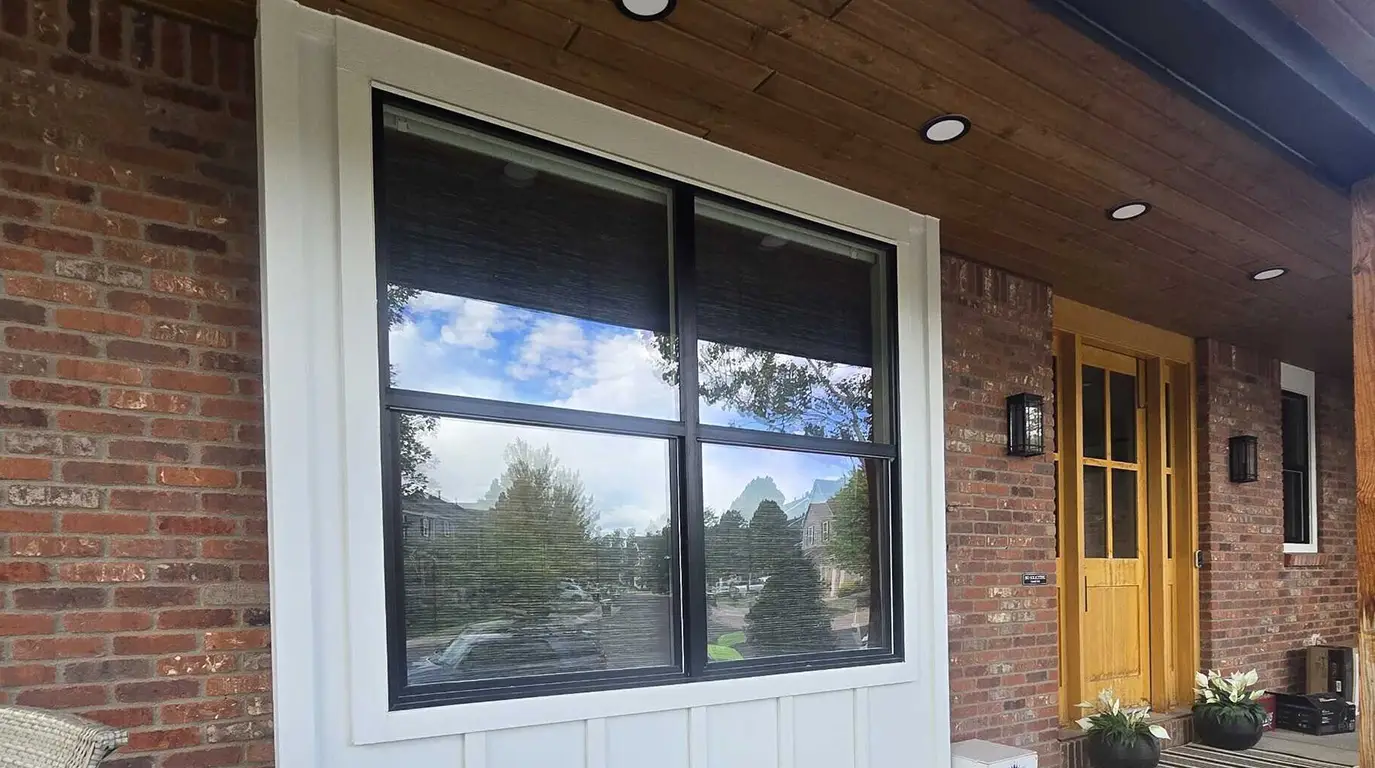 Highlands Ranch - Arctic White board and batten, a stained Woodtone porch ceiling